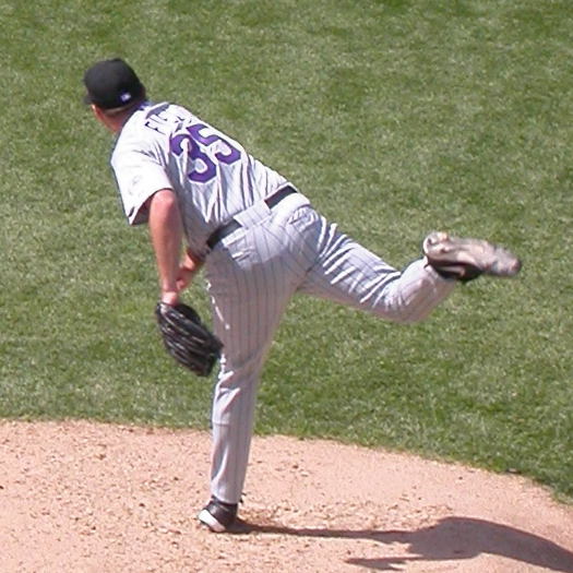  Nate Field on the pitcher's mound in Colorado Rockies uniform.