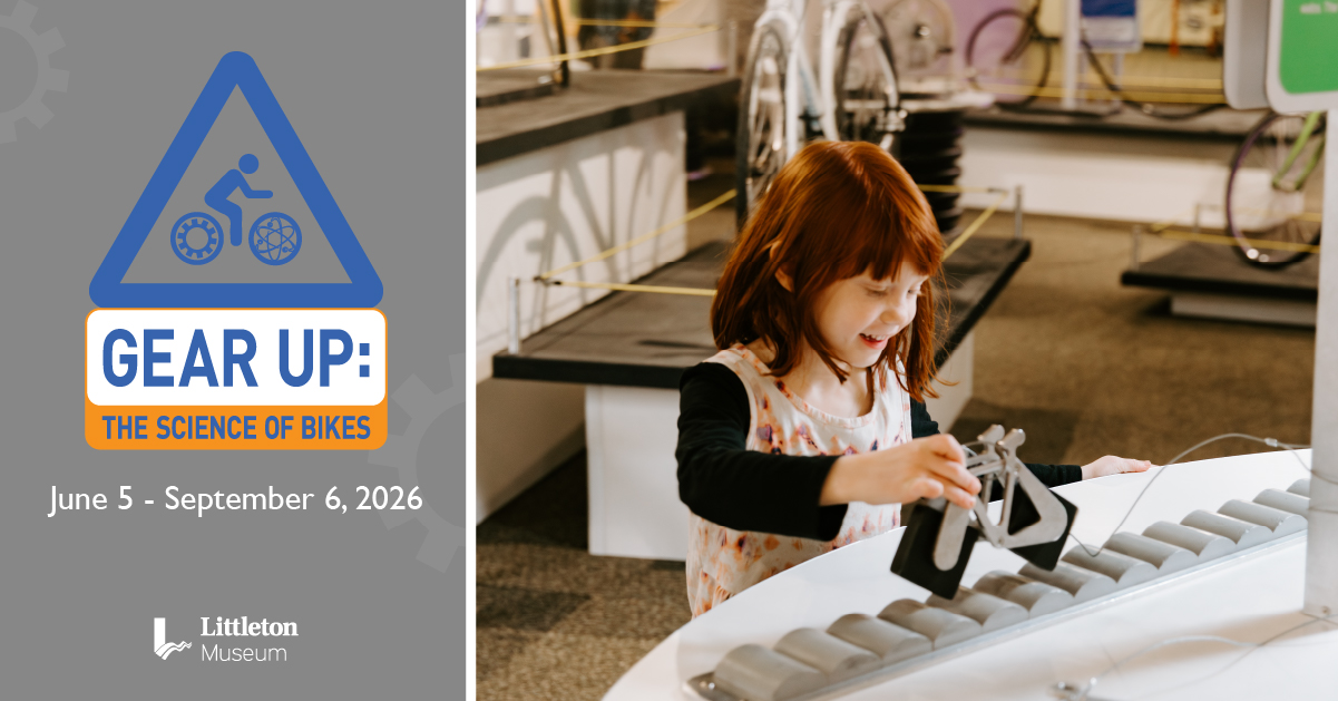 Photo of a small child rolling a model bicycle with square wheels along a track
